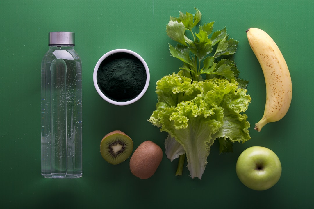 various healthy foods and ingredients on a green background