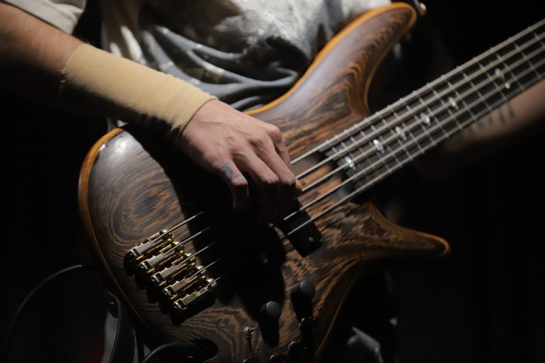 Bass guitar, musical performance, concert — Play Pokdeng Online and Enjoy Endless Fun Today