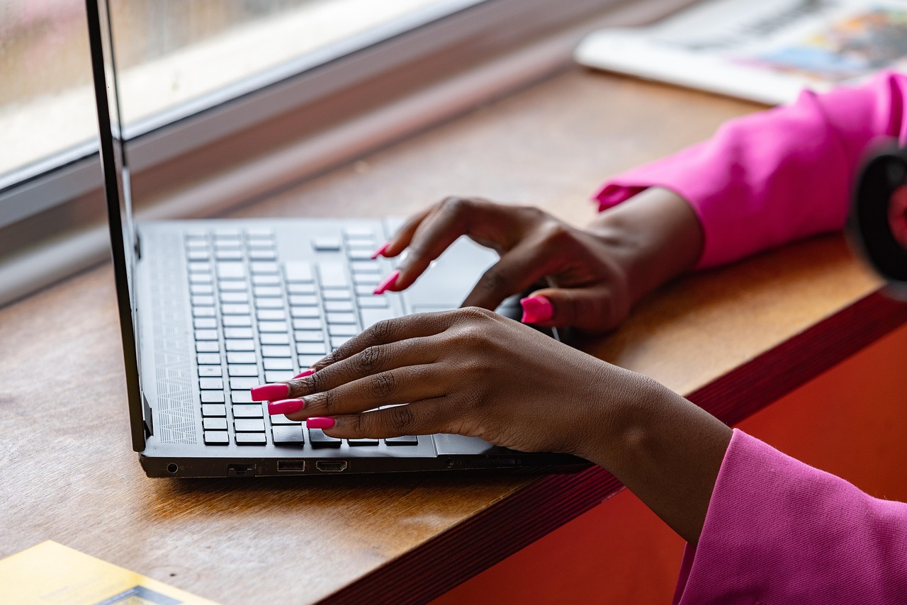 Laptop, typing, working — The Art and Sensuality of Erotic Massage in London