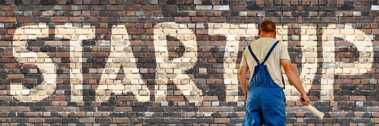 Startup, wall, painter — What to Expect from Volunteer Programs Abroad: Everything You Need to Know